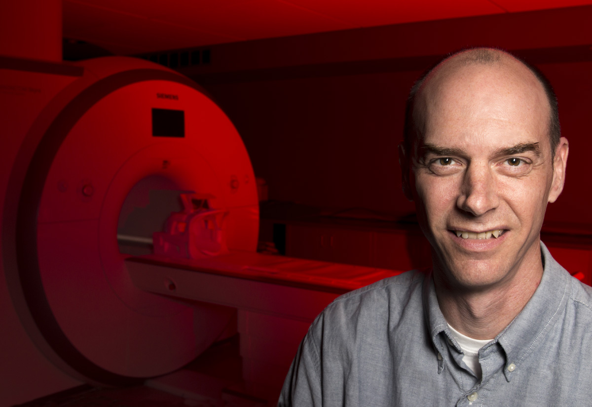 Glenn Wylie in Imaging Room with red background