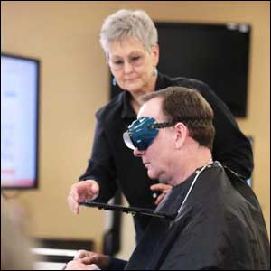 Man with special goggles for scientific stroke research 