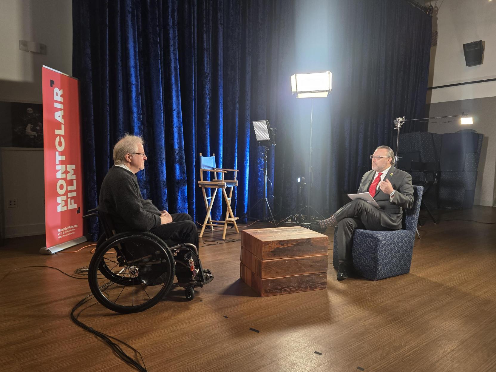 Two men seating having a conversation