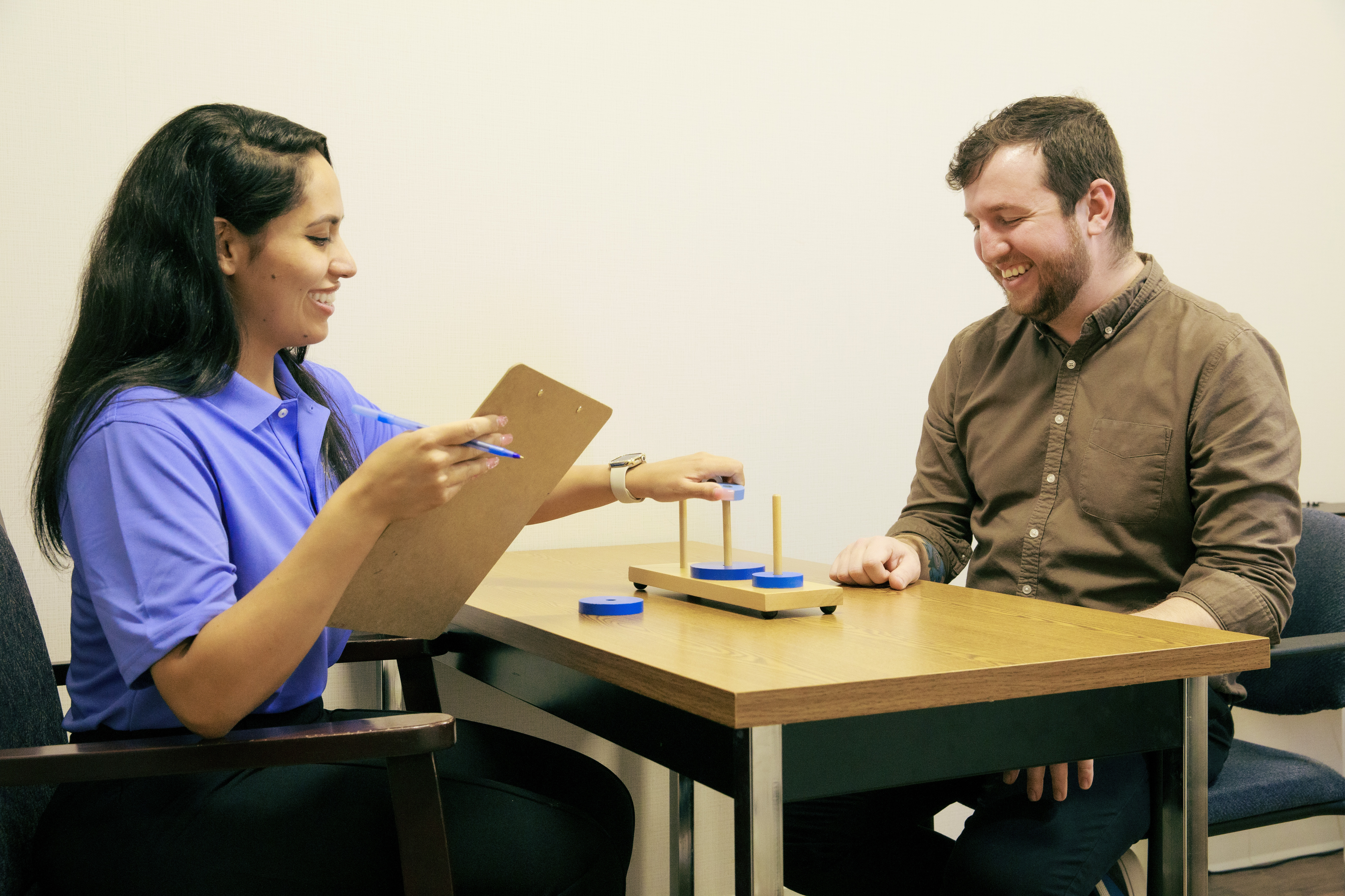 A researcher and participant engaging in thinking tasks during a study session.