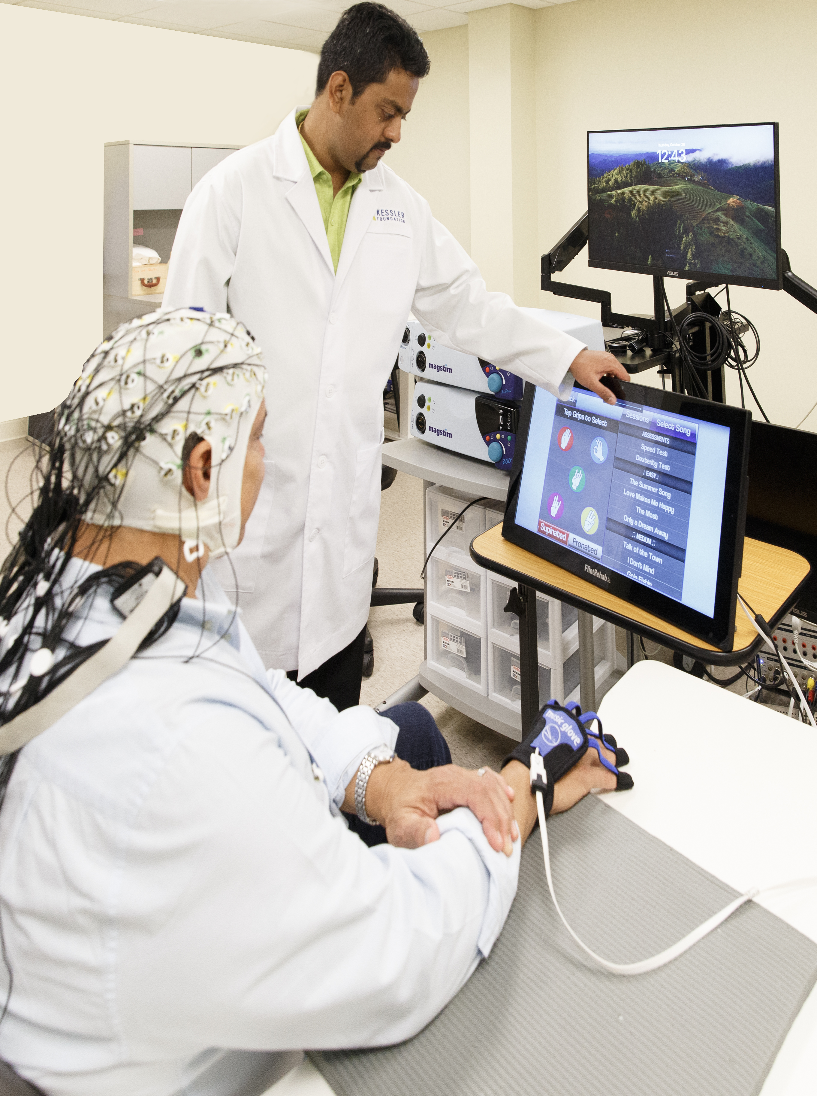 Researcher and participant during a study session using brain stimulation equitment.