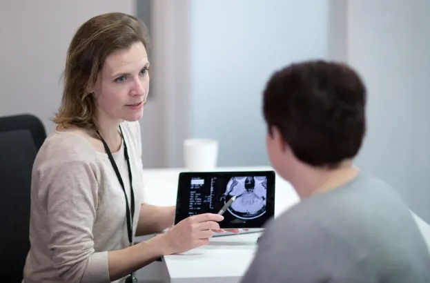 Female Medical Doctor explaining scan results to patient