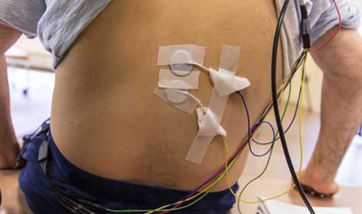male participant with electrodes on his back