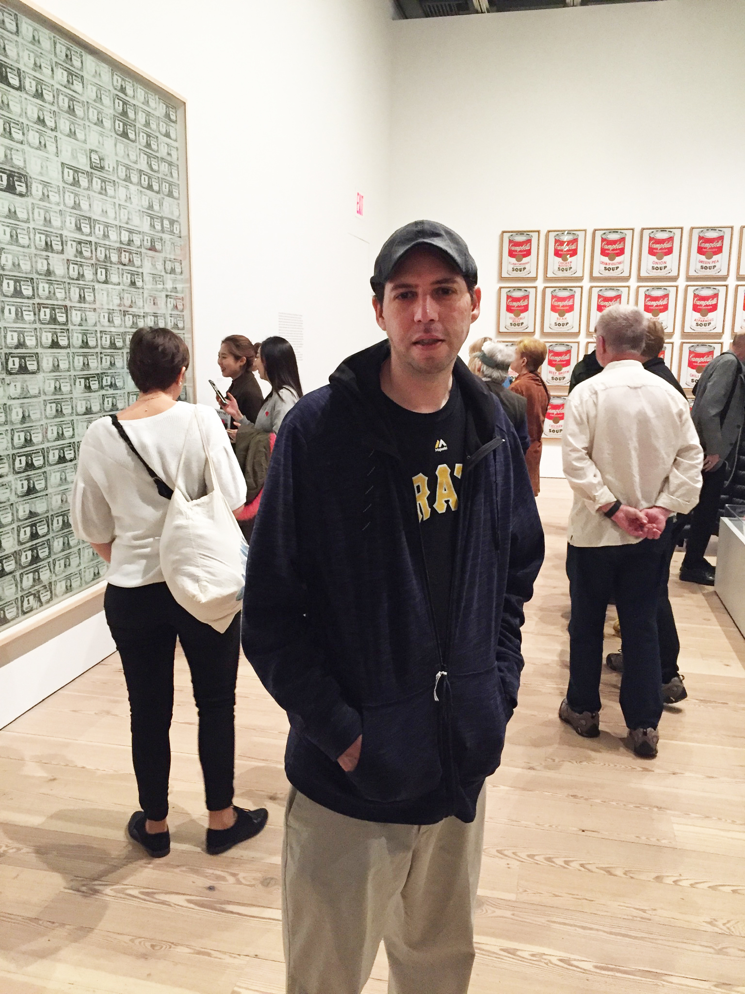 Kenny Diamond standing in an art gallery