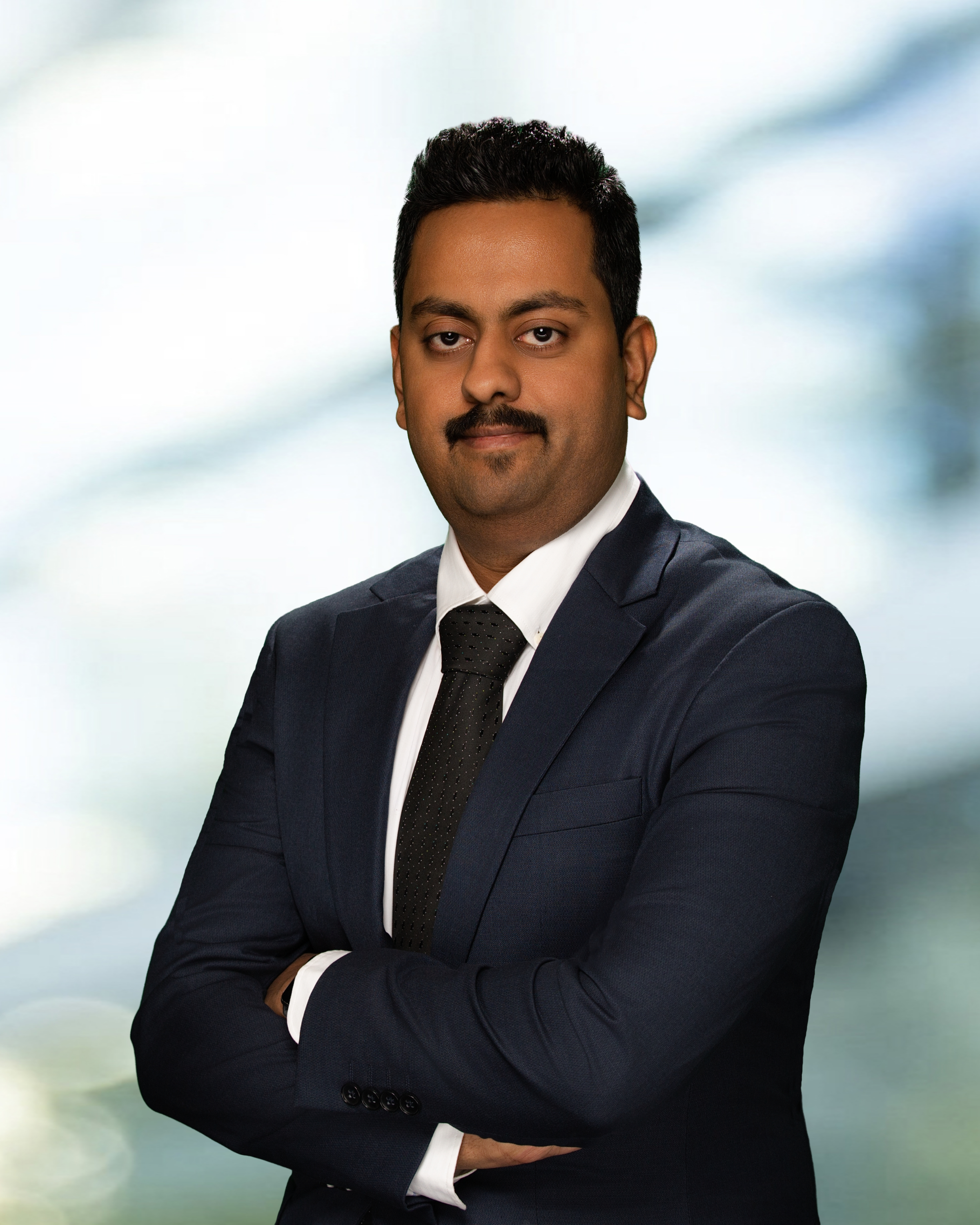 headshot of Virkram Shenoy Handiru