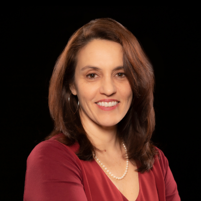  Headshot of Amanda Botticello, PhD, MPH. She has medium length brown hair and is wearing a red sweater.