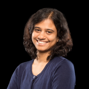 Headshot of Kiran Karunakaran, PhD. She is wearing a dark blue sweater.