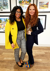 two women posing for the camera 