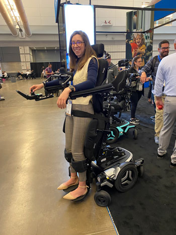 Woman wearing a robotic mechanism that enables her to walk