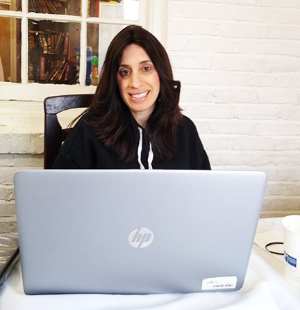 Chaya Lebovic, sitting in front of her computer 