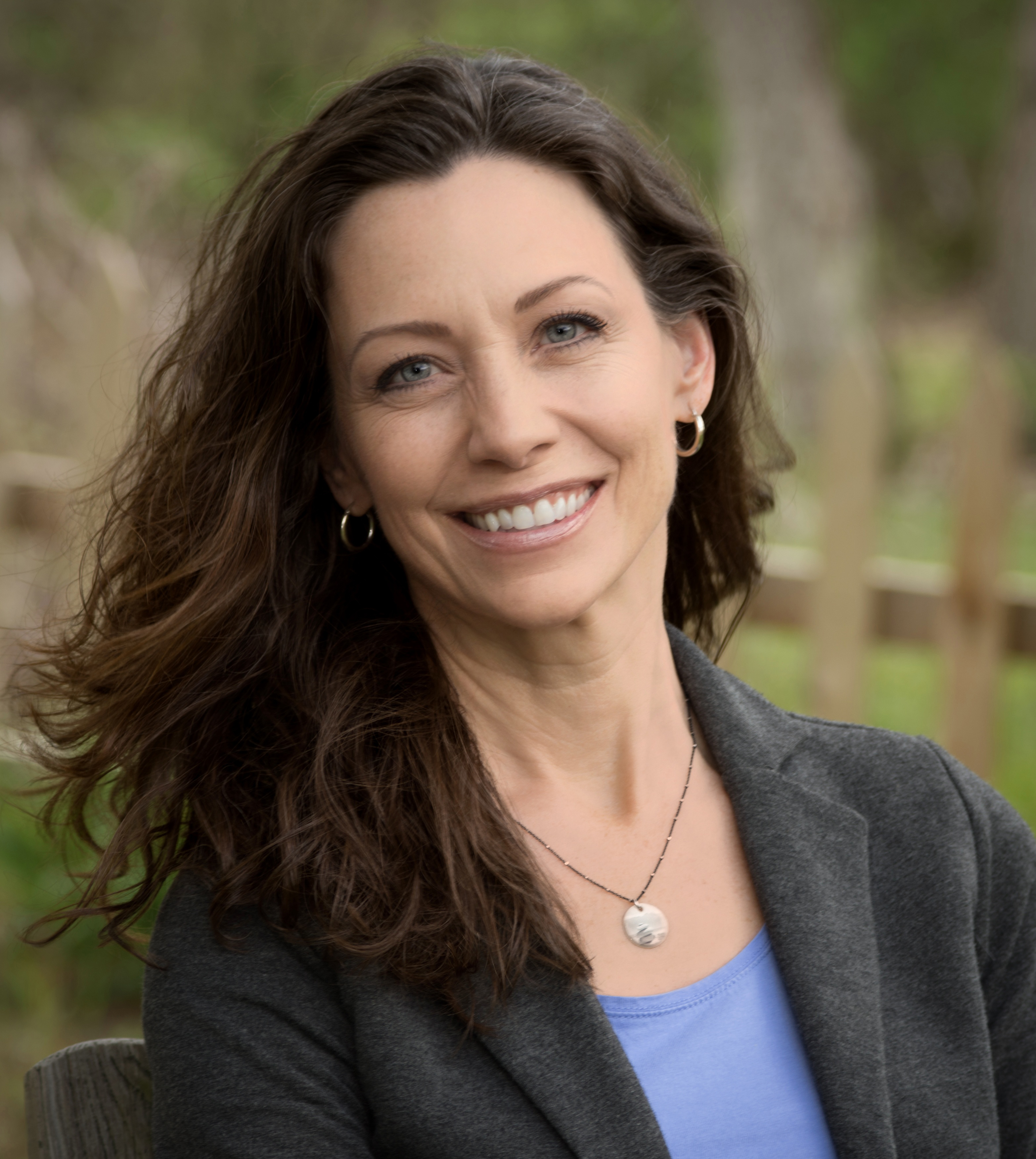 Headshot of Stacia Bissell, MEd. She is wearing a gray blazer and light blue top.