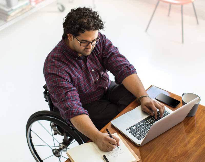 Man with a checkered shirt in a wheelchair