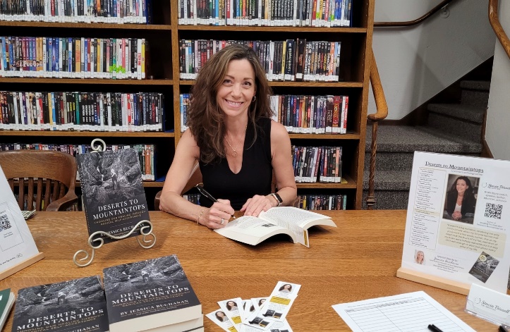 A person sitting at a desk with a book</p>
<p>AI-generated content may be incorrect.