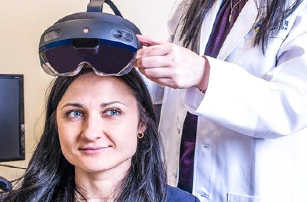 Scientist using VR equipment with participant