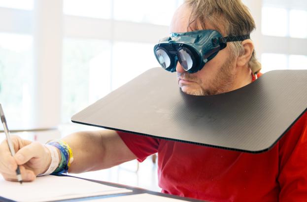 participant using the spatial neglect goggles 