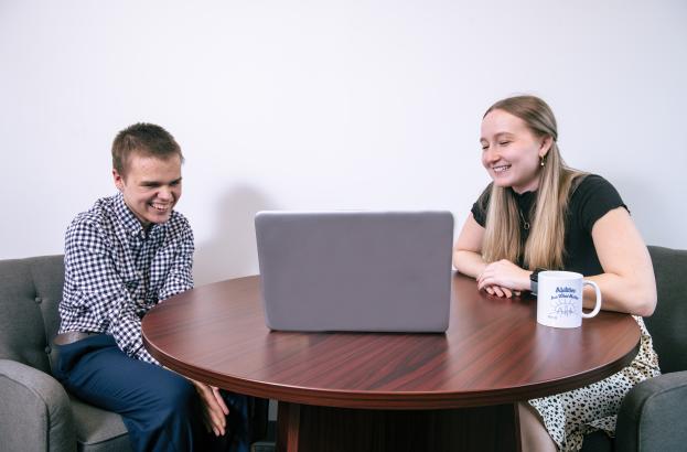 Researcher and participant working together on the computer during a study session.
