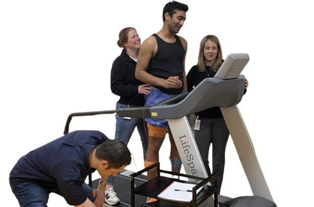 A participant working with research team on the TBI mobility study using transcutaneous stimulation