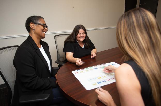 Photo showing a group using the memory game study materials.
