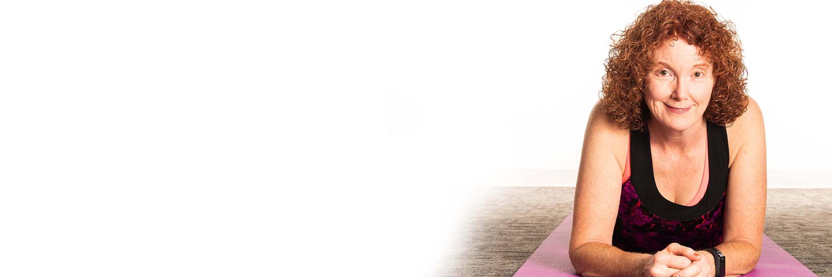 participant with MS is still active, she is laying on a purple yoga mat