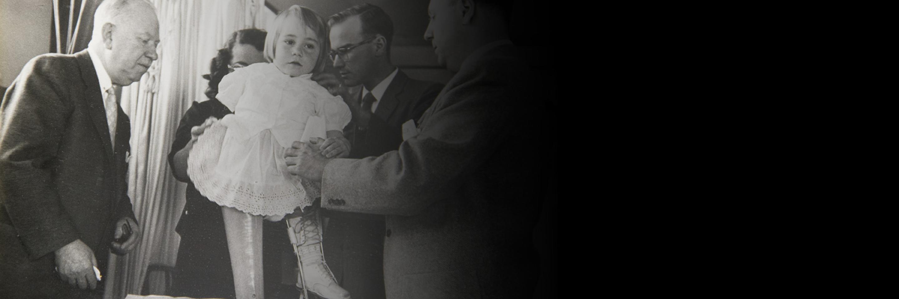Henry H. Kessler, MD with pediatric patient
