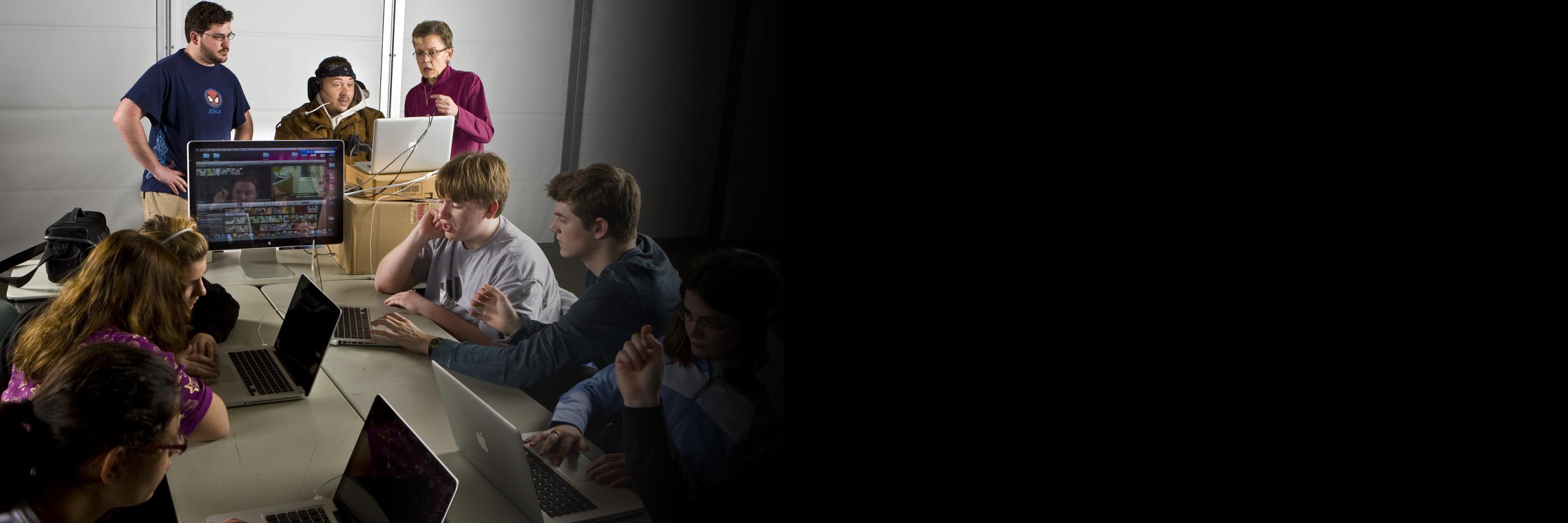 Participants in a room full of laptop computers