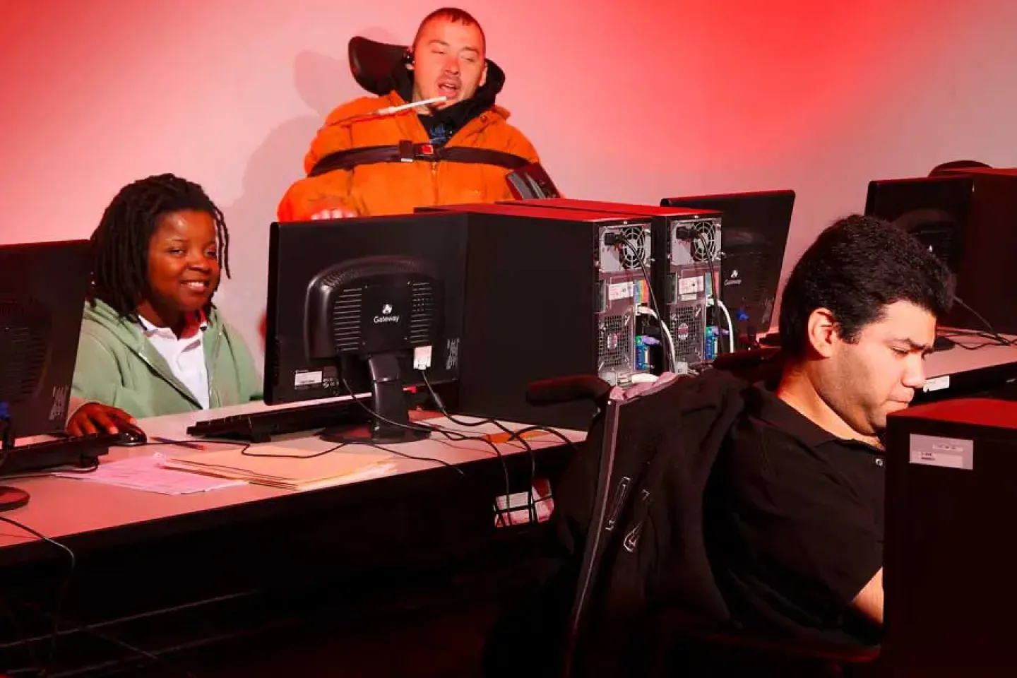 people with disabilities working on desktop workstations.