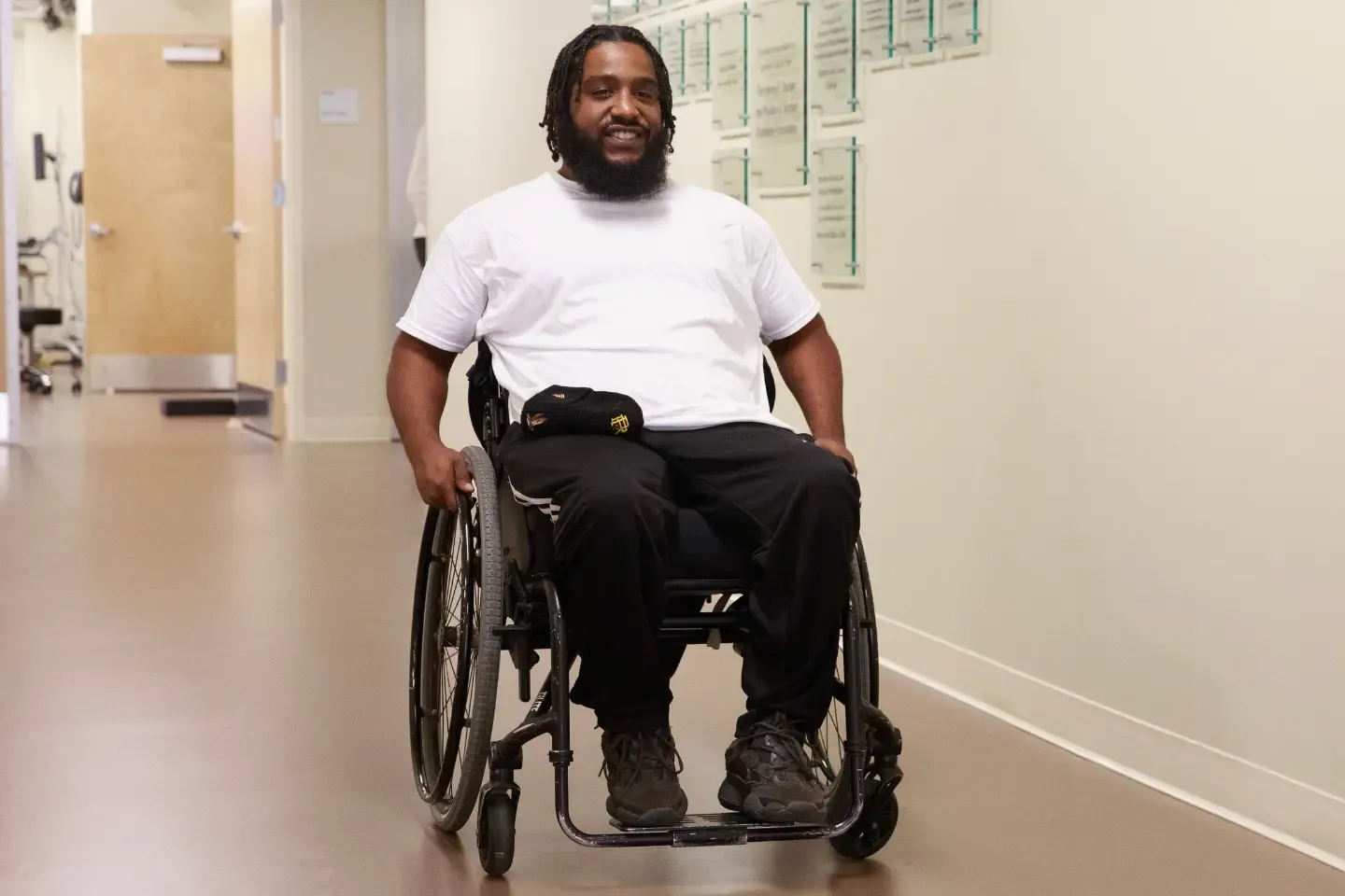 Black male in a wheelchair at a medical center