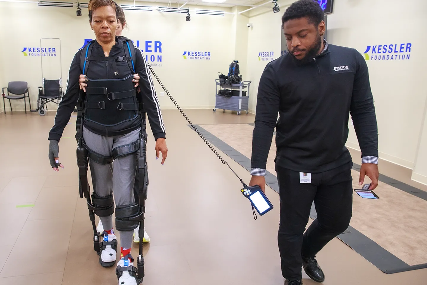 Woman with a exoskeleton mechanism that enables her to walk.