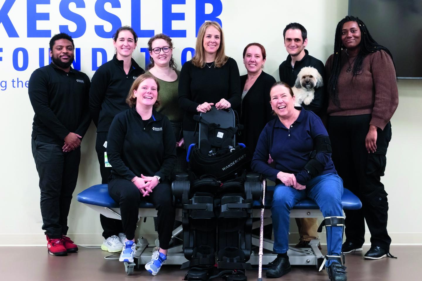 Suzanne cliff (first row, right) with her "chosen" family, Dr. Karen J. Nolan (back row, center) and the robotic exoskeleton research team.