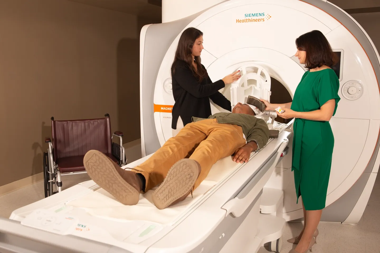 image of a man preparing to get scan by an MRI machine