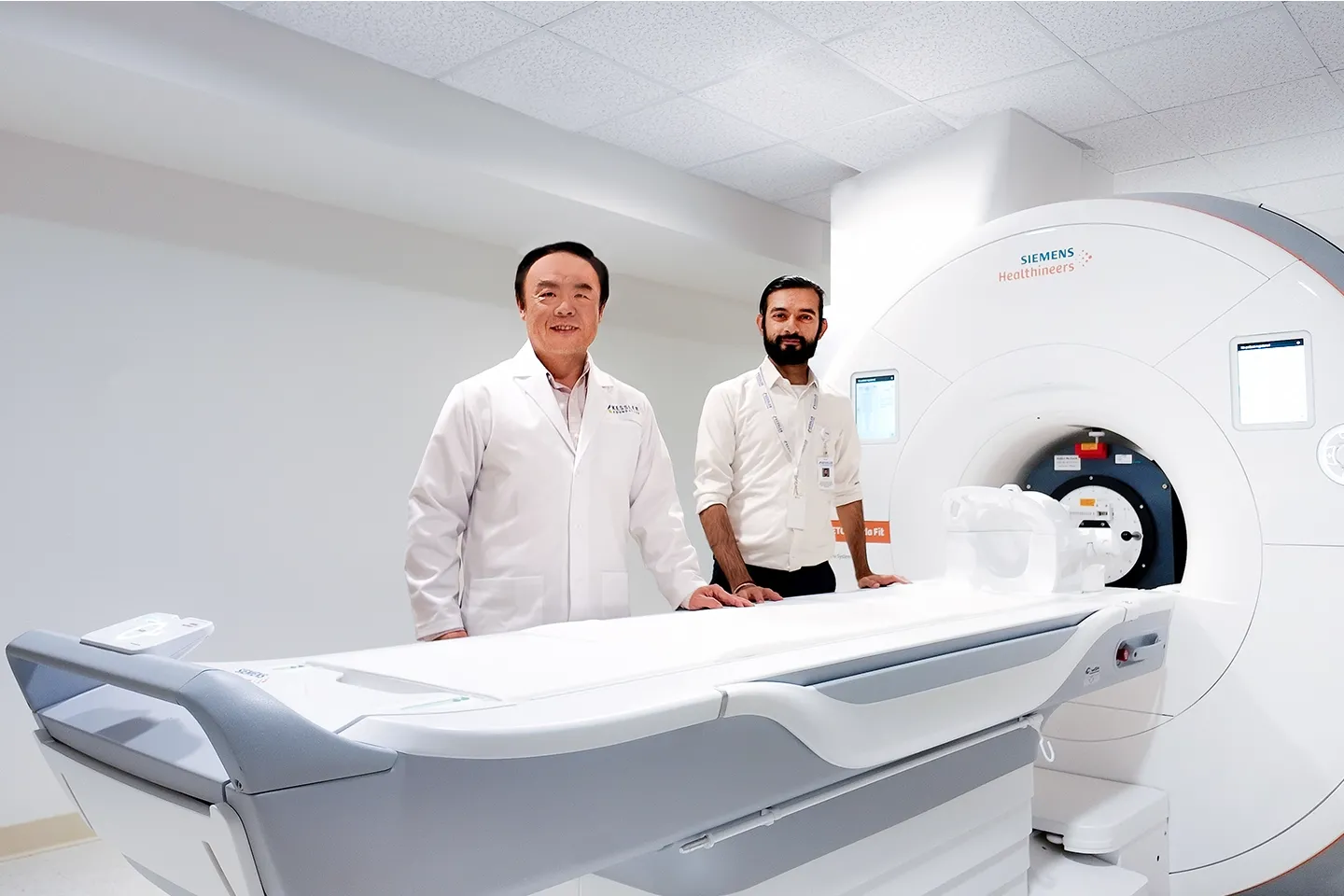 picture of Brian-Chirag in front of the scanner
