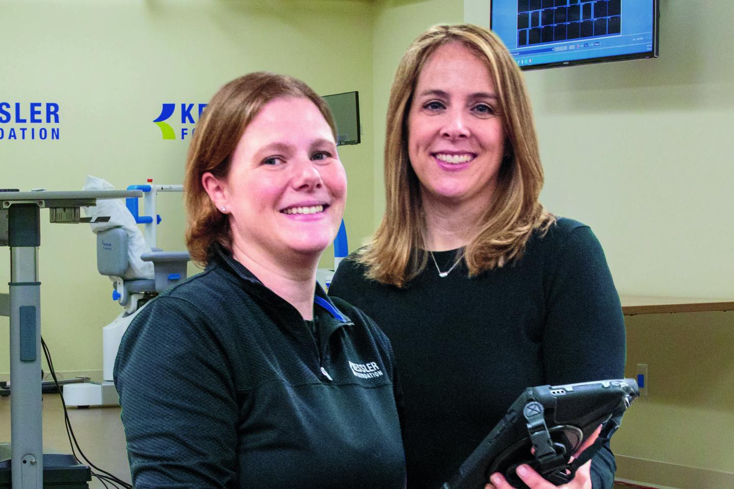 image of two women looking at a ipad