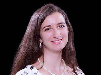 Headshot Daniela Cassano with a Black Background