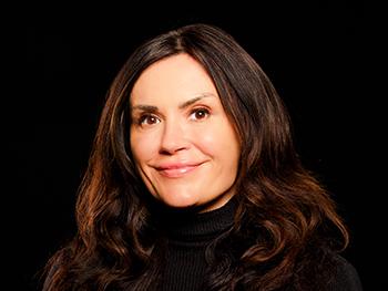 Headshot of Diane Perri with black background