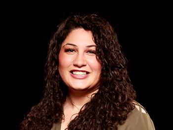 Headshot of Amanda A. Quintero with black background