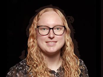 Headshot of Megan Rusco with a black background