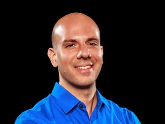 Headshot of Christopher Cagna with black background