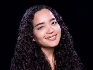 Headshot of Rebeca Costa do Nascimento on a black background