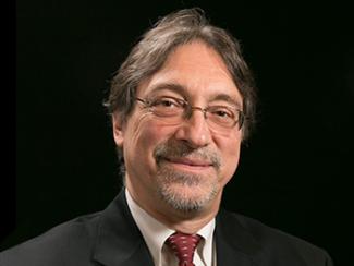 Head shot of John Deluca