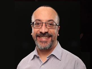 Headshot of Anthony Lequerica, PhD on a black background