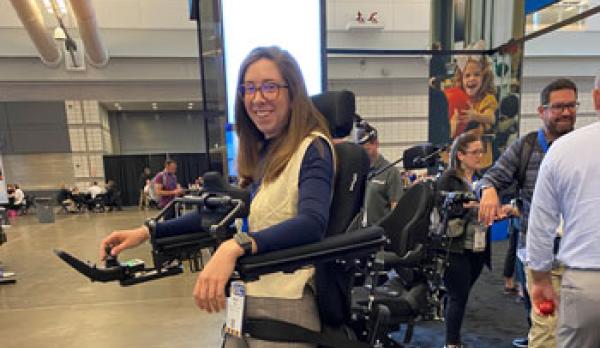 Woman wearing a robotic mechanism that enables her to walk