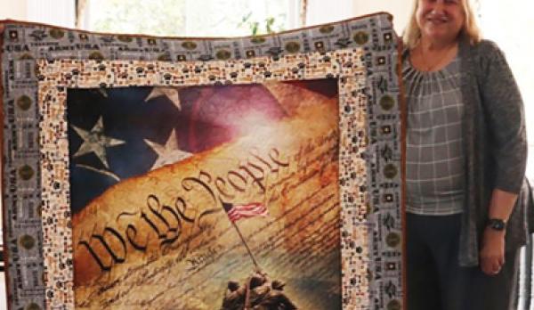 lynn webb TBI survivor with quilt