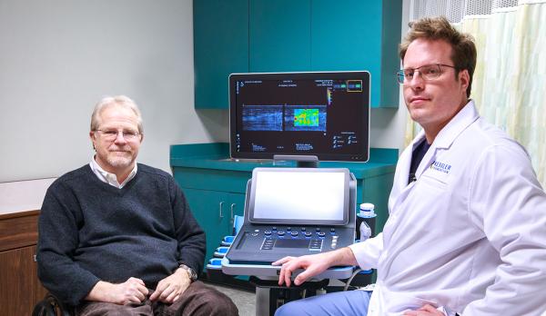 Drs. Dyson-Hudson and Hogaboom showing  Extracorporeal Shockwave Therapy