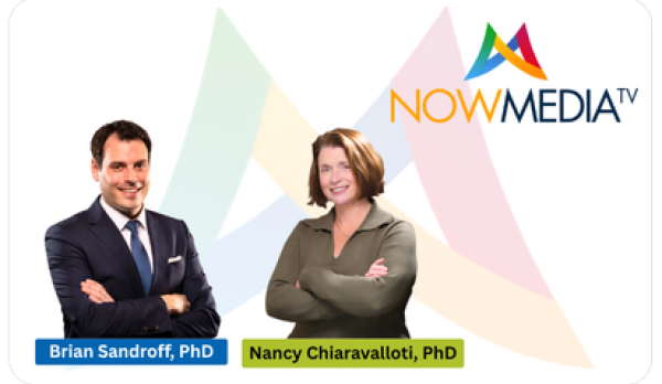 A graphic featuring the image of a man in a suit with his arms crossed and a woman with short hair and a long-sleeve shirt, also with her arms crossed, and a "Now Media" logo in the background.