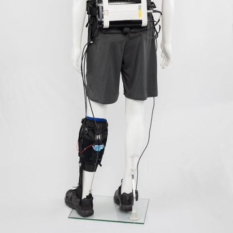 A mannequin wearing/displaying a soft robotic wearable exosuit 