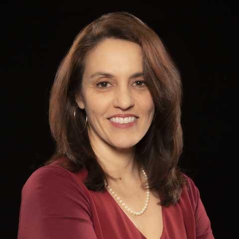 female associate director scientist at Kessler Foundation wearing a maroon color blouse