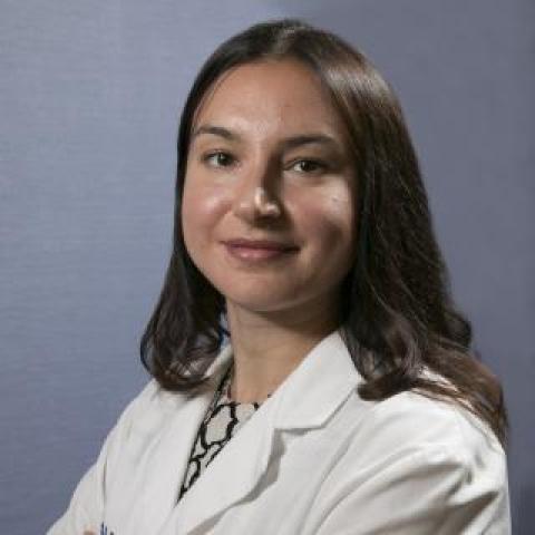 dr boukrina with arms crossed wearing a lab coat