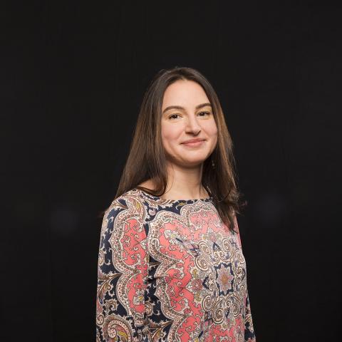 Head shot of Dr. Olga Boukrina against a black background