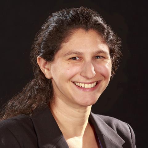 Female research scientist wearing a black jacket with dark hair