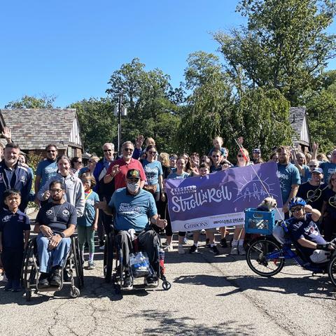 group of people both people with and without disabilities at verona park. 2021 Stroll 'N Roll starting line group photo